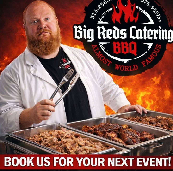 Big Red serving smoked meats from the catering trays